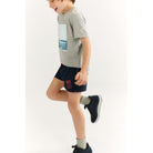 Springender Junge in Ecoalf Dolphinalf Swimsuit Boys | Kinder Badehose
